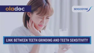 A woman experiencing toothache due to sensitivity.
