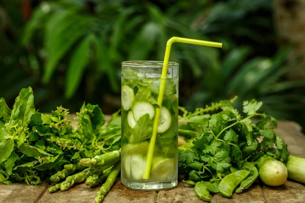 cucumber detox water in glass with straw